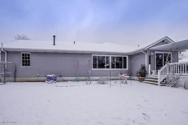 view of snow covered house