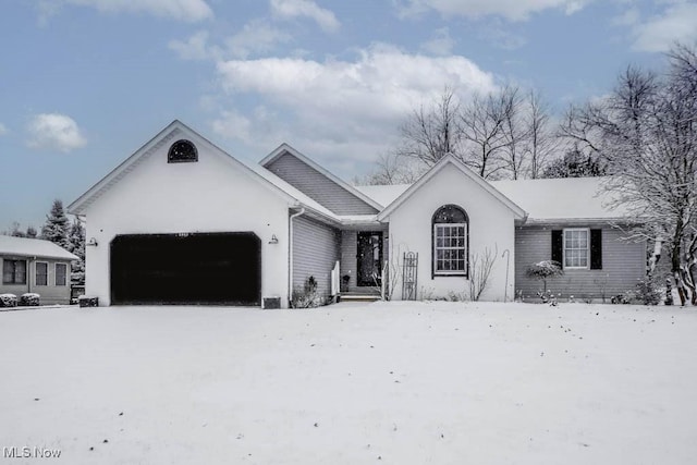 single story home featuring a garage