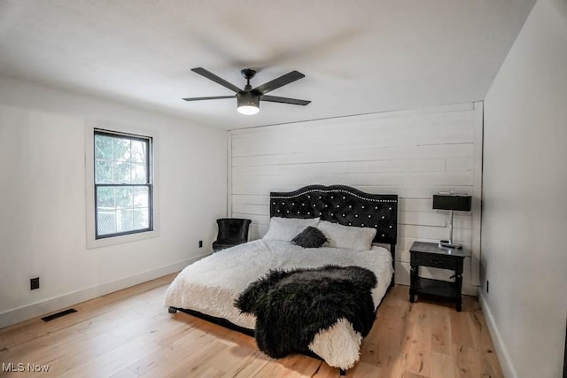 bedroom featuring ceiling fan and light hardwood / wood-style flooring