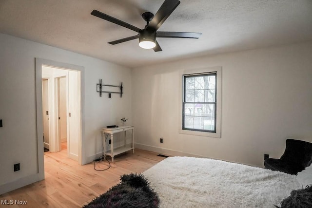 bedroom featuring ceiling fan and light wood-type flooring