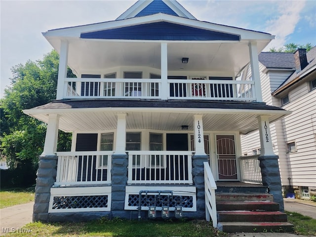 view of front of home with a balcony and covered porch