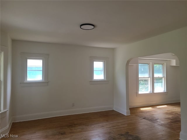 bonus room featuring dark hardwood / wood-style flooring and plenty of natural light