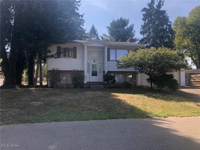 bi-level home with a front yard