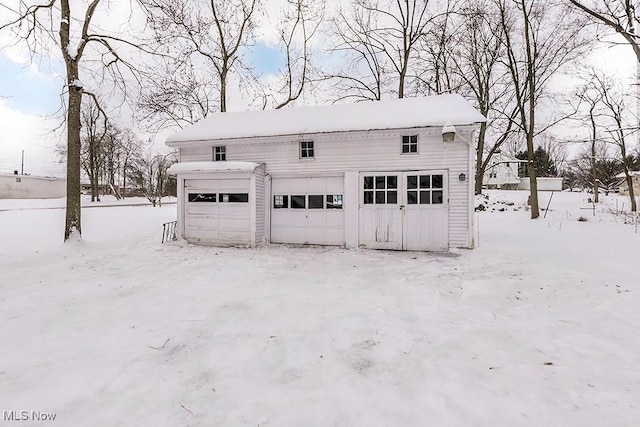 view of snow covered garage