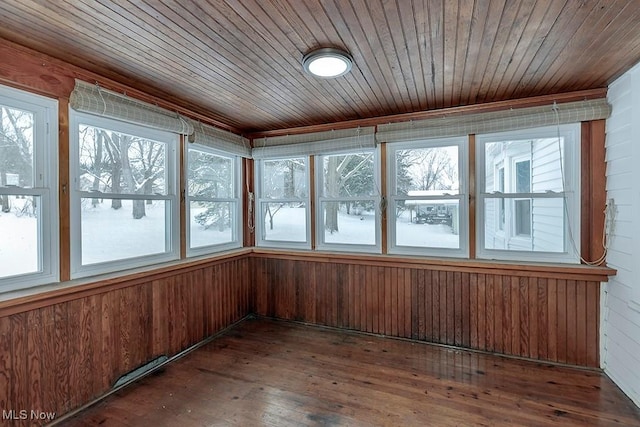 unfurnished sunroom with wooden ceiling