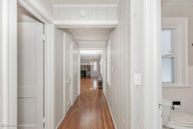 corridor with wood-type flooring