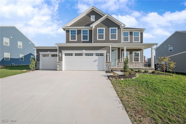 craftsman-style house featuring a front yard and a garage