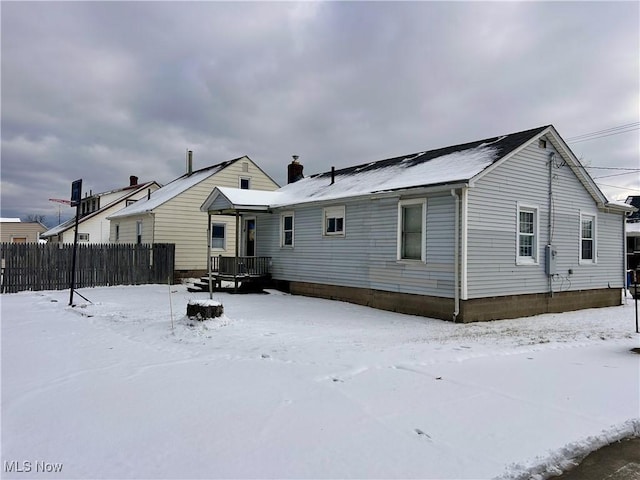 view of snow covered house