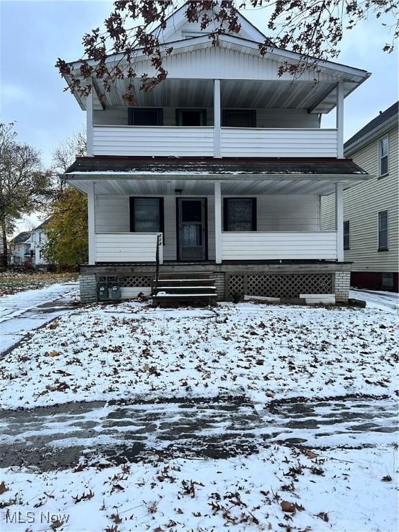 view of front of house featuring a balcony and a porch