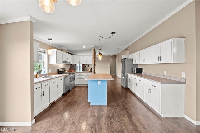 kitchen with a center island, hanging light fixtures, ceiling fan, white cabinetry, and stainless steel appliances