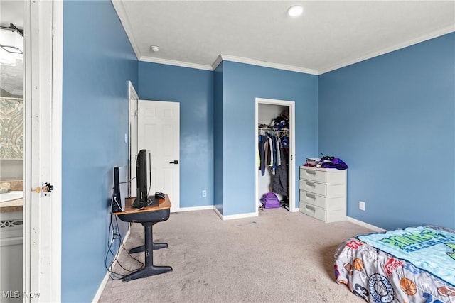 bedroom with carpet, a walk in closet, crown molding, and a closet