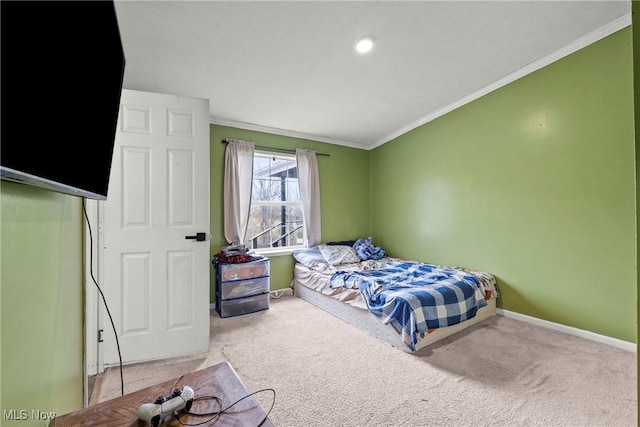 carpeted bedroom featuring crown molding