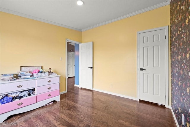 bedroom with crown molding and dark hardwood / wood-style flooring