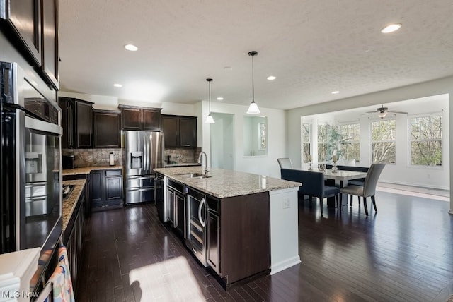 680 Morgan Trl, Aurora, OH 44202 - kitchen with stainless steel appliances, dark wood-style flooring, wine cooler, and a sink