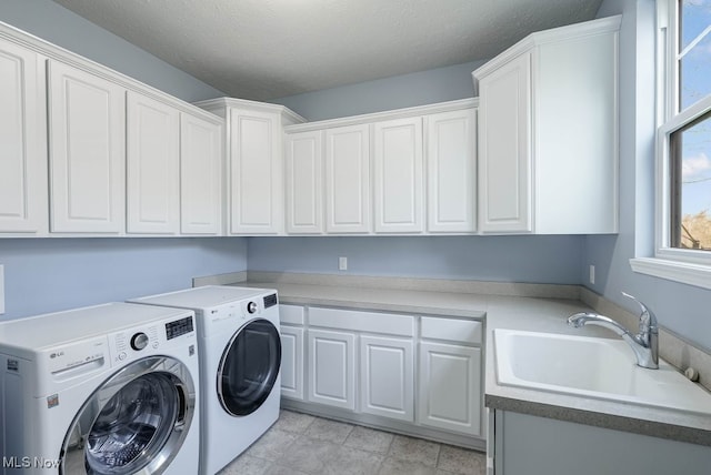 680 Morgan Trl, Aurora, OH 44202 - laundry room featuring a sink, cabinet space, and independent washer and dryer