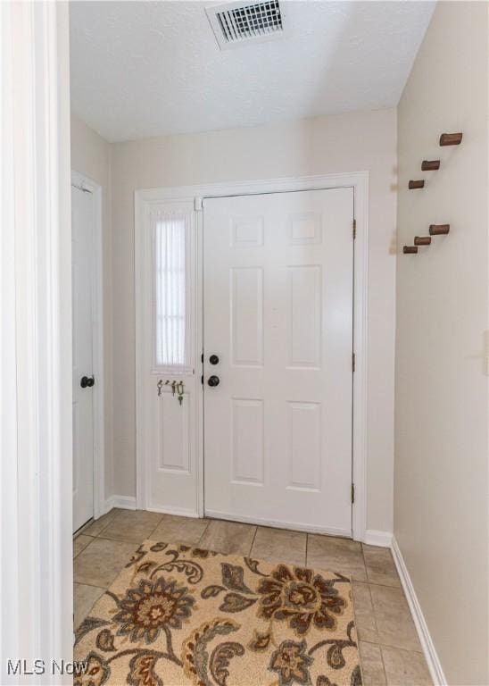 view of tiled foyer entrance