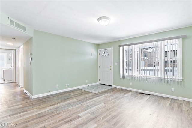 spare room featuring light wood-type flooring