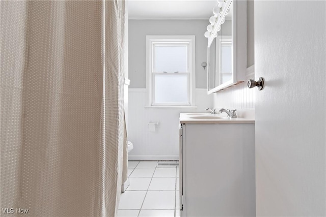 bathroom featuring toilet, vanity, and tile patterned floors