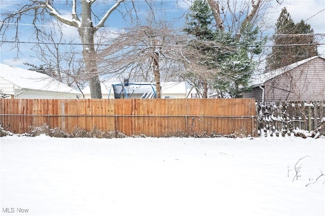 view of yard covered in snow