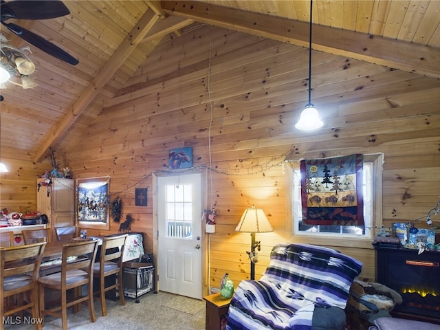 bedroom featuring carpet, wooden ceiling, high vaulted ceiling, wooden walls, and beamed ceiling