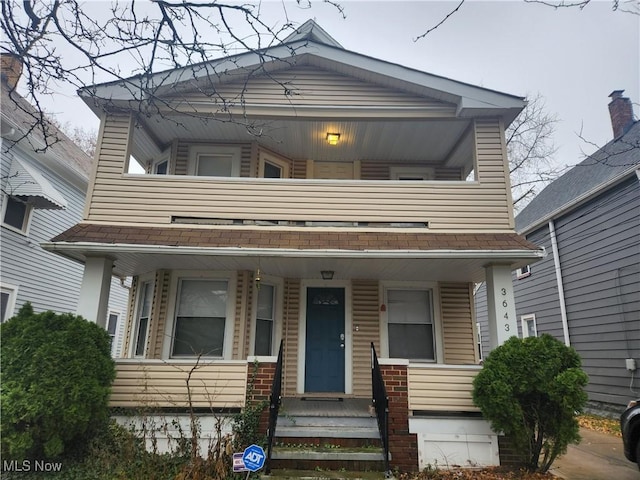 view of front of home featuring a balcony