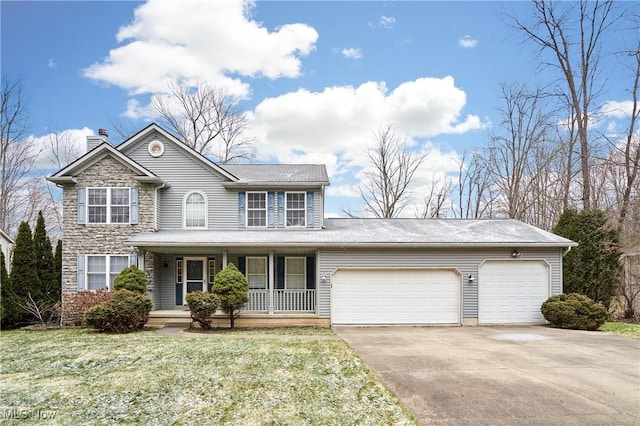 view of front of home featuring covered porch, a front yard, and a garage