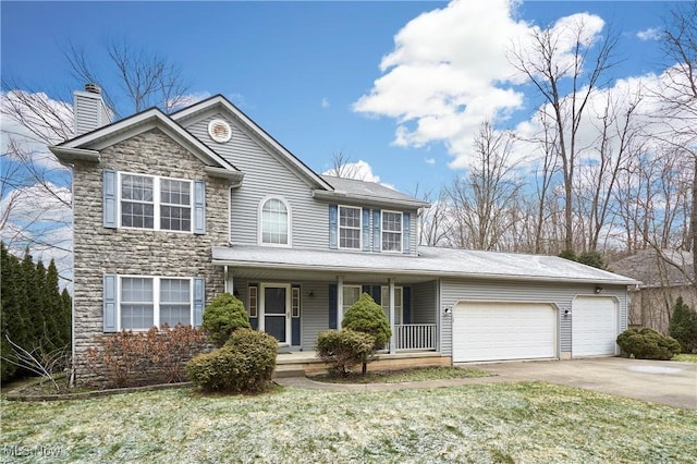 view of front facade featuring a front yard, a porch, and a garage