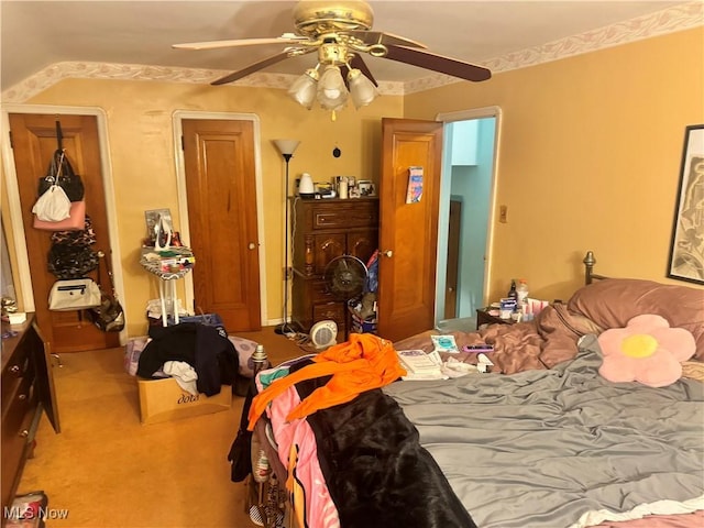 bedroom with light colored carpet and ceiling fan