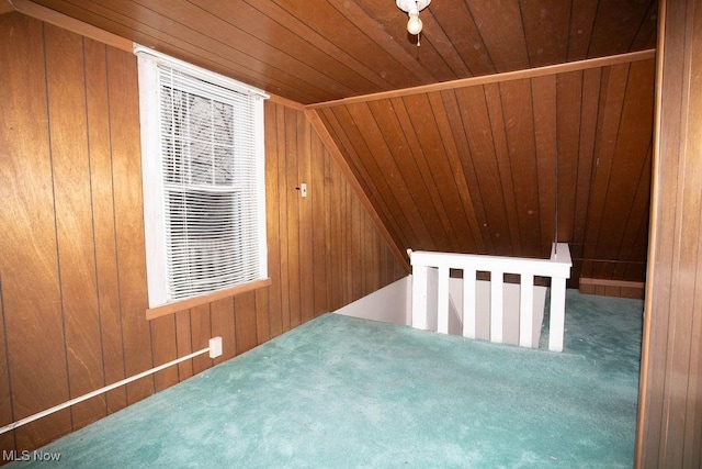 bonus room featuring wood walls, carpet, wood ceiling, and lofted ceiling