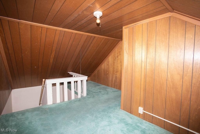 bonus room featuring wood ceiling, lofted ceiling, carpet floors, and wooden walls