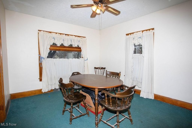 dining space with carpet flooring and ceiling fan