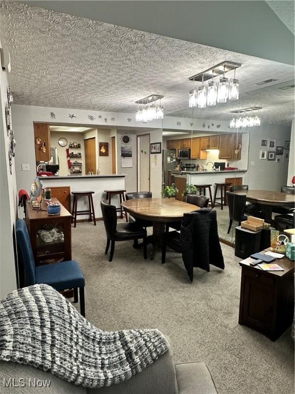 dining area with light colored carpet