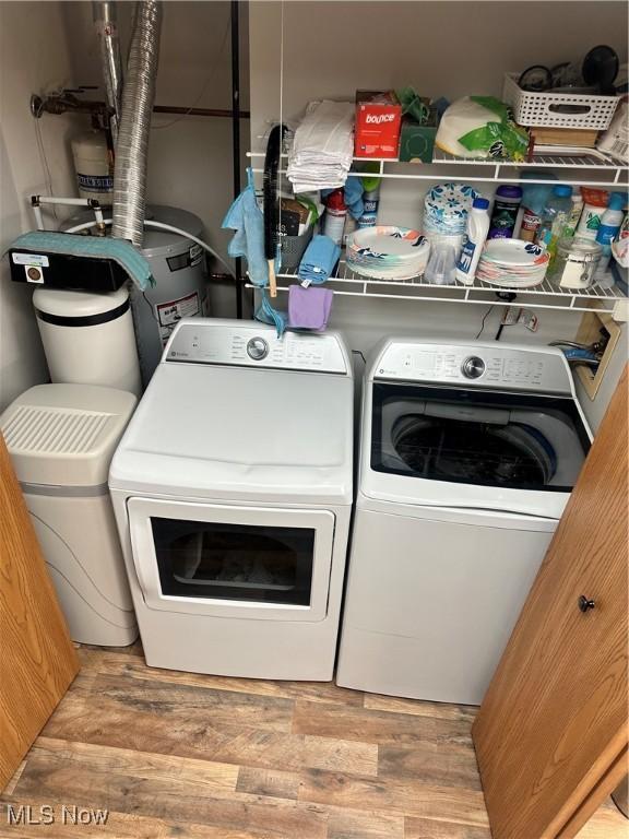 laundry area featuring light hardwood / wood-style floors and washer and dryer