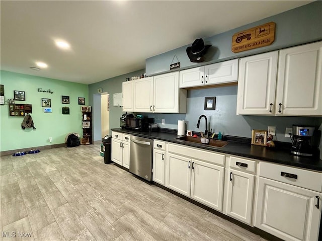 kitchen featuring stainless steel dishwasher, light hardwood / wood-style floors, sink, and white cabinets