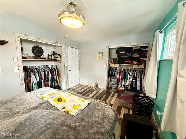 bedroom with hardwood / wood-style floors and a closet