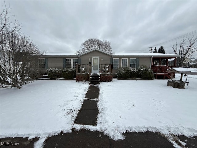 view of front of house with a wooden deck