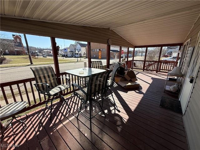 wooden deck with a residential view