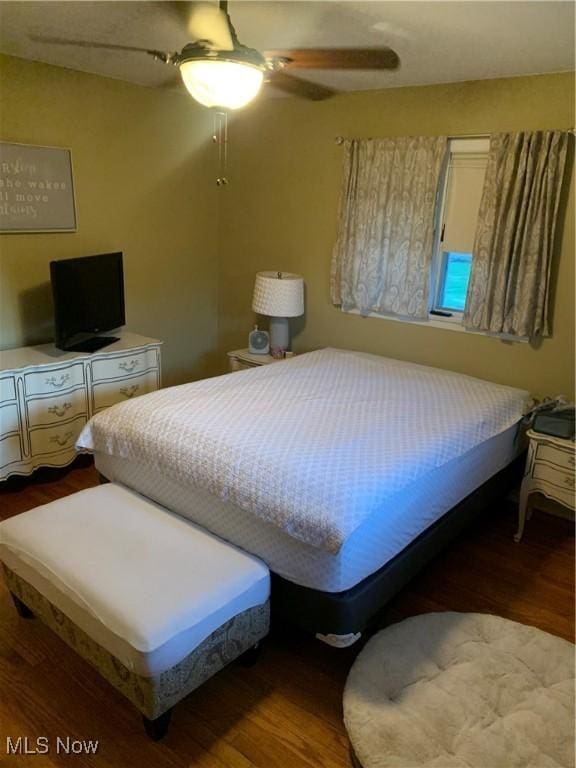 bedroom featuring ceiling fan and wood-type flooring