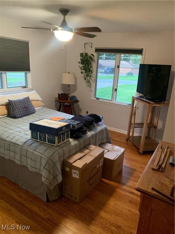 bedroom with hardwood / wood-style flooring and ceiling fan