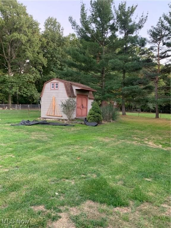 view of outdoor structure with a lawn