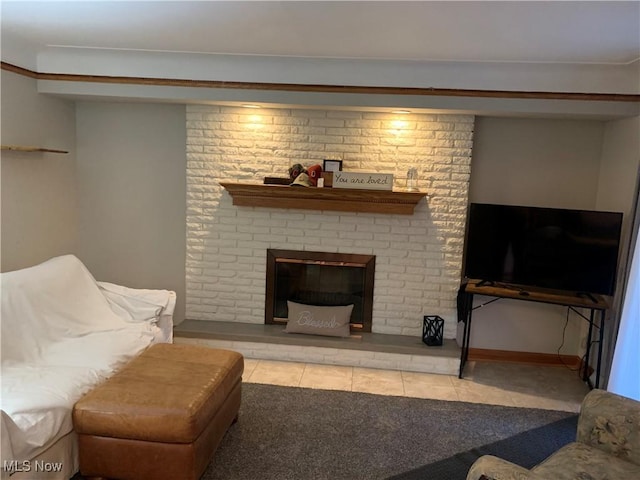 tiled living room with a brick fireplace