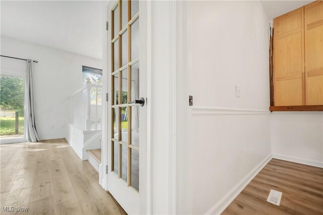 6301 Fiesta Ct, Lorain, OH 44053 - corridor featuring light wood finished floors and baseboards