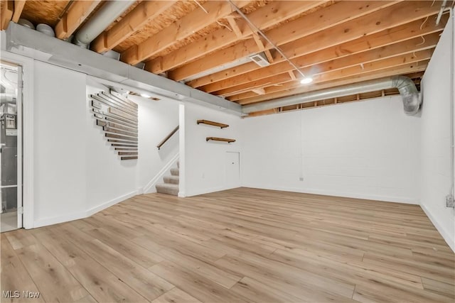6301 Fiesta Ct, Lorain, OH 44053 - finished basement with stairs and light wood-style floors