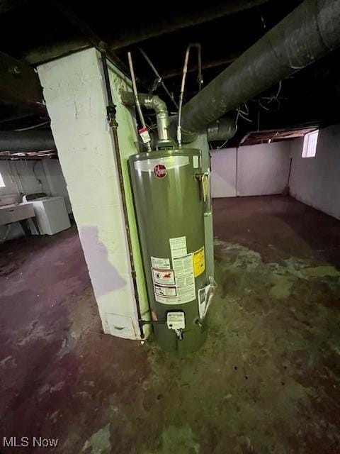 utility room with gas water heater