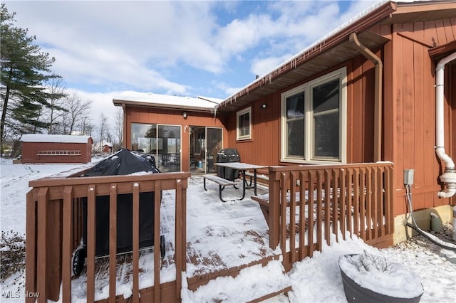 view of snow covered deck