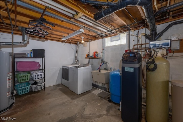 basement with washer and dryer, gas water heater, and sink