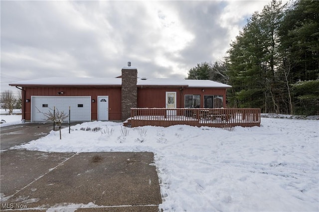 view of front of house with a garage and a wooden deck