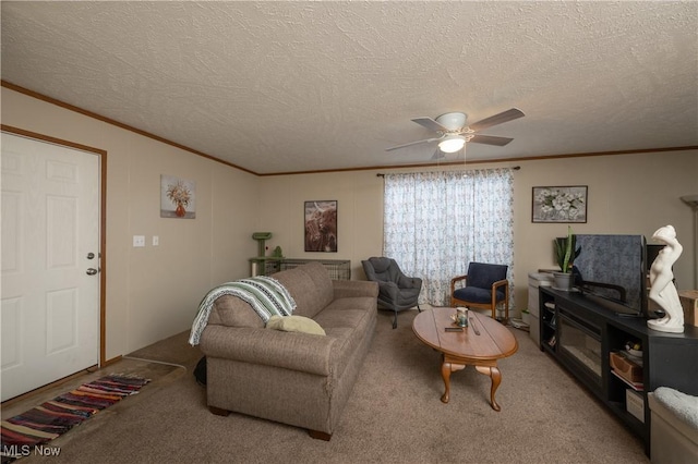 carpeted living room with ceiling fan, ornamental molding, and a textured ceiling