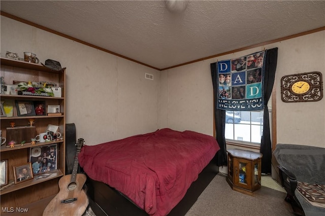 bedroom featuring carpet floors, ornamental molding, and a textured ceiling