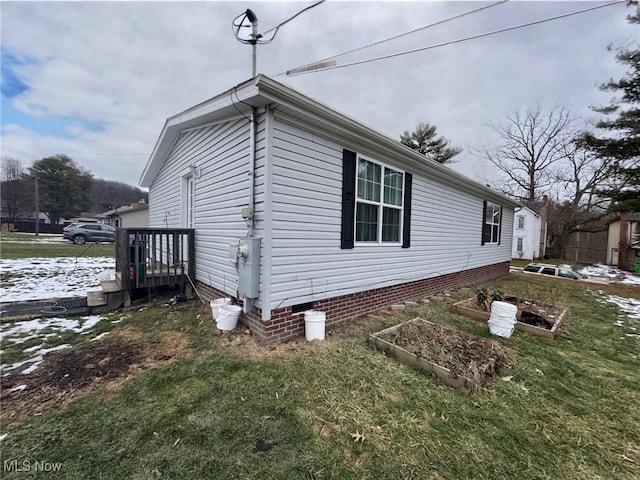 view of property exterior with a yard